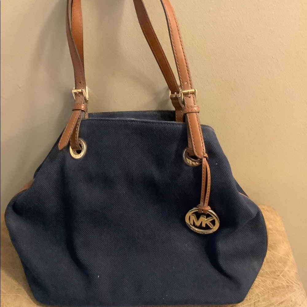 Gently used Michael Kors navy blue canvas purse.